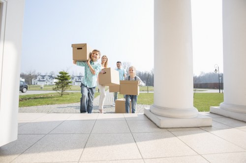 Unpacking boxes in a Bermondsey flat after relocation