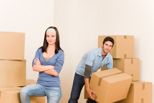 Furniture being carried from a Bermondsey apartment during a professional move