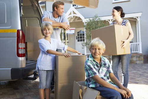 Professional movers handling items in a Bermondsey apartment building